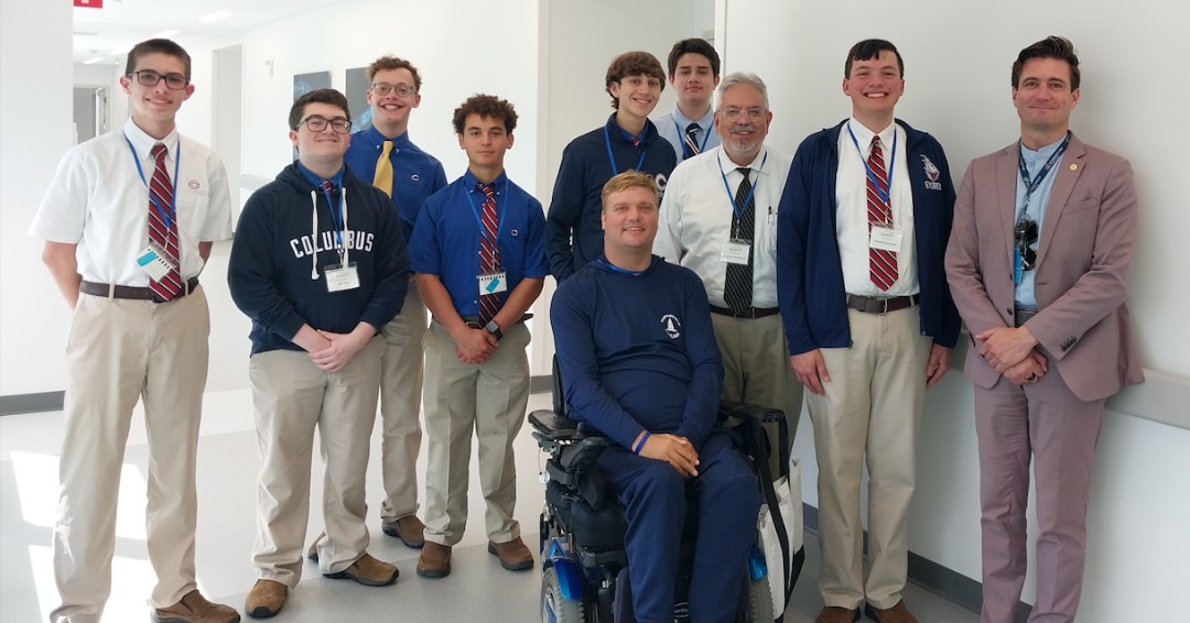 The Enabling Access team with a patient at the Christine E. Lynn Rehabilitation Center