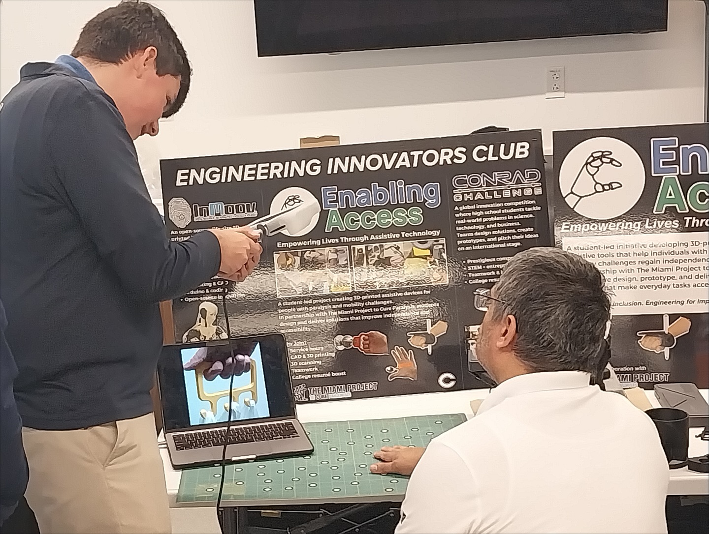 Club display with 3D scanning technology and project posters